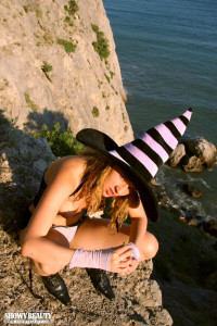 Curly blonde on cliffs