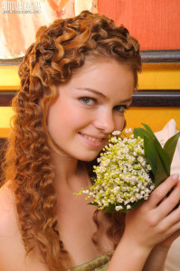 Curly girlfriend in bed