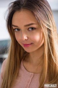 Teen model posing on the kitchen table