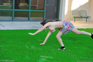 Leila does cartwheels topless outside