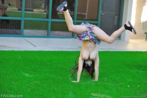 Leila does cartwheels topless outside