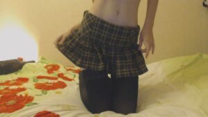 Kandy Strips from her Plaid Skirt and Black Stockings