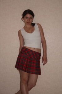 Kandy in her short red Tartan Skirt