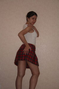 Kandy in her short red Tartan Skirt